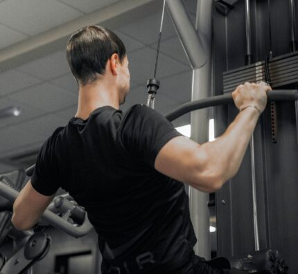 Guest enjoying modern gym facilities at the hotel with state-of-the-art fitness equipment and welcoming atmosphere.